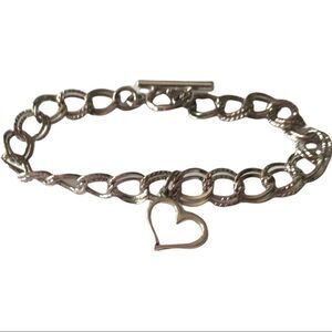 Silvertone charm bracelet with heart.